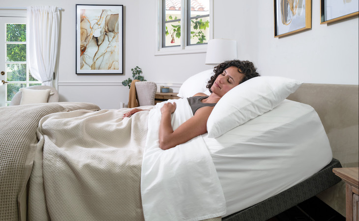 person lying on an adjustable base