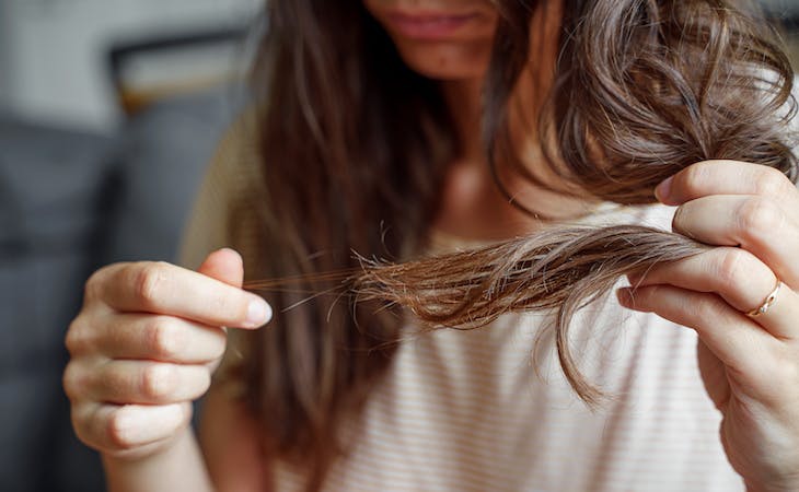 person examining hair