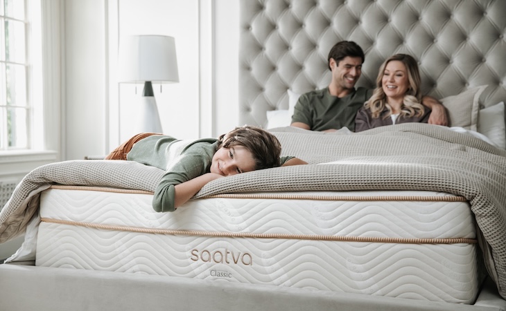 family on large saatva bed