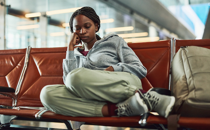 person sleeping in airport