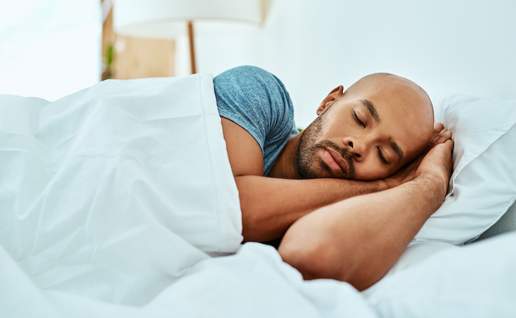 person sleeping and burning calories during sleep