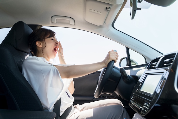 person falling asleep in car